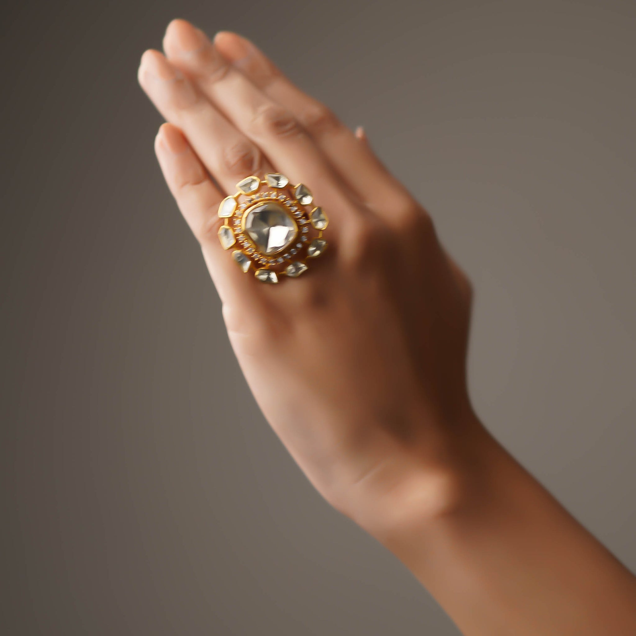 Surya Kundala Moissanite Gold Finish Ring with Stone Work
