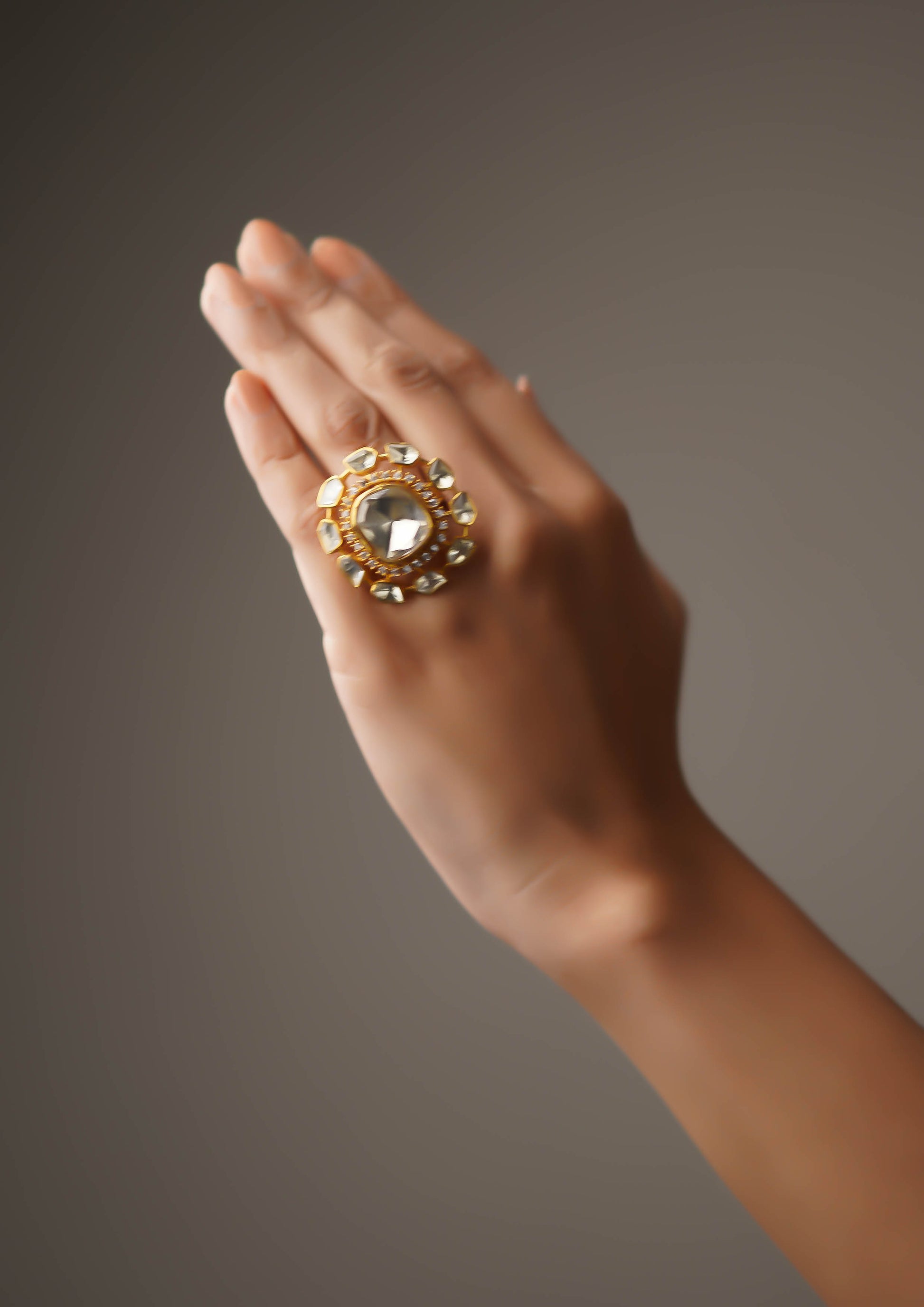 Surya Kundala Moissanite Gold Finish Ring with Stone Work